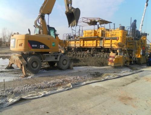 Laying of cement concrete pavement PK235 