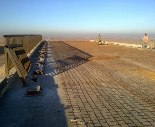 Installment of guardrails and mesh reinforcement under concrete for overpass at PK84