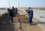 Ramming of ditch under lighting cable near approaches to bridge